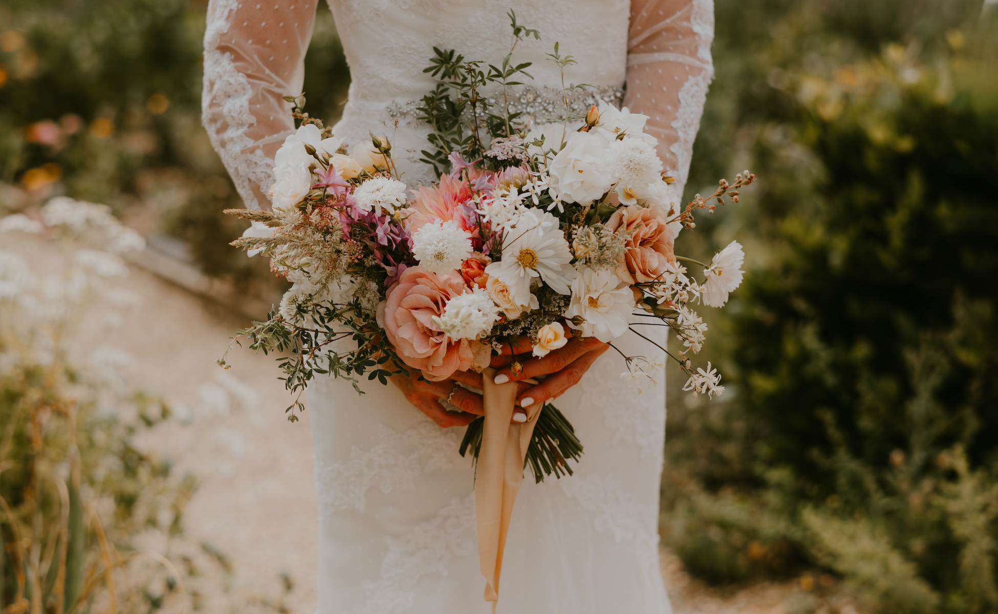 Detail shot of the bridal bouquet featuring seasonal summer blooms